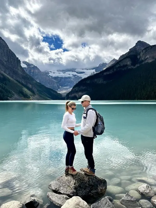 Megs and Pat standing on a rock at Lake Louise, Banff